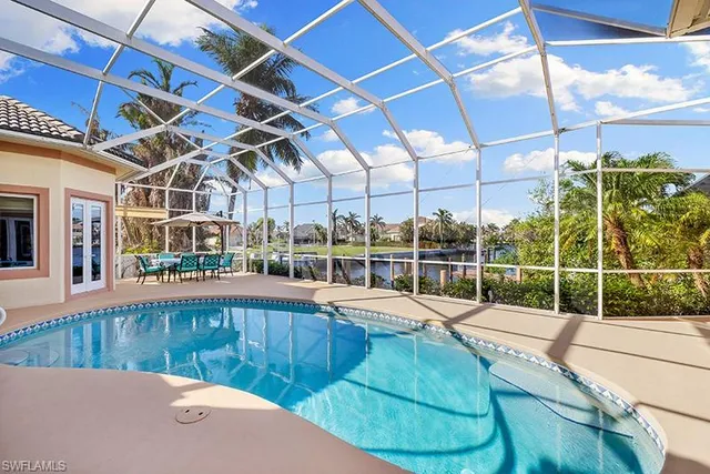 a view of a swimming pool with a patio