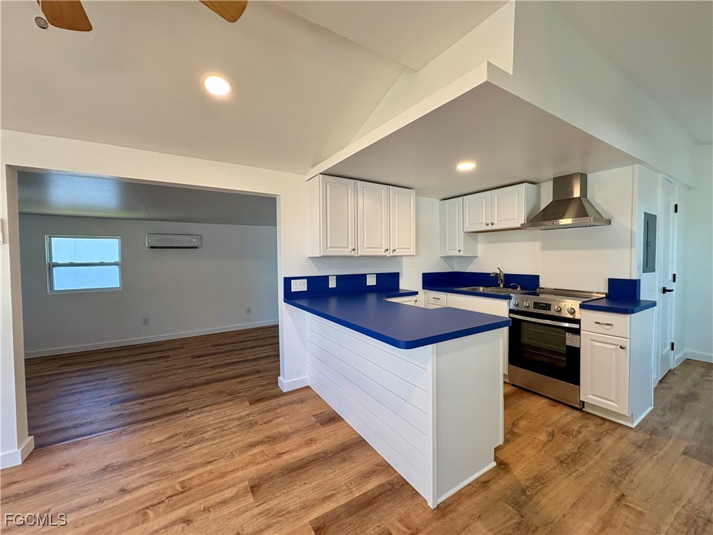5675 Pine Island Road St. James City, FL 33956 - Photo 14 of 28 a kitchen with stainless steel appliances granite countertop a stove and a sink