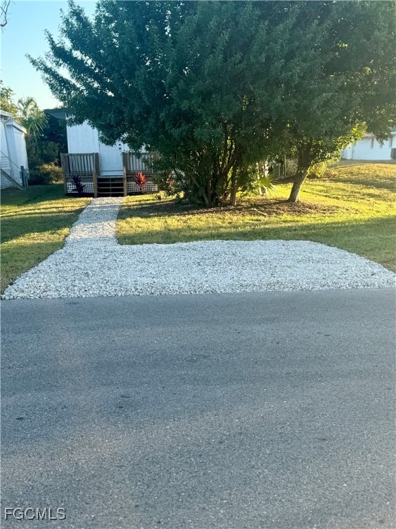 5675 Pine Island Road St. James City, FL 33956 - Photo 2 of 28 a view of a swimming pool with a yard and swimming pool