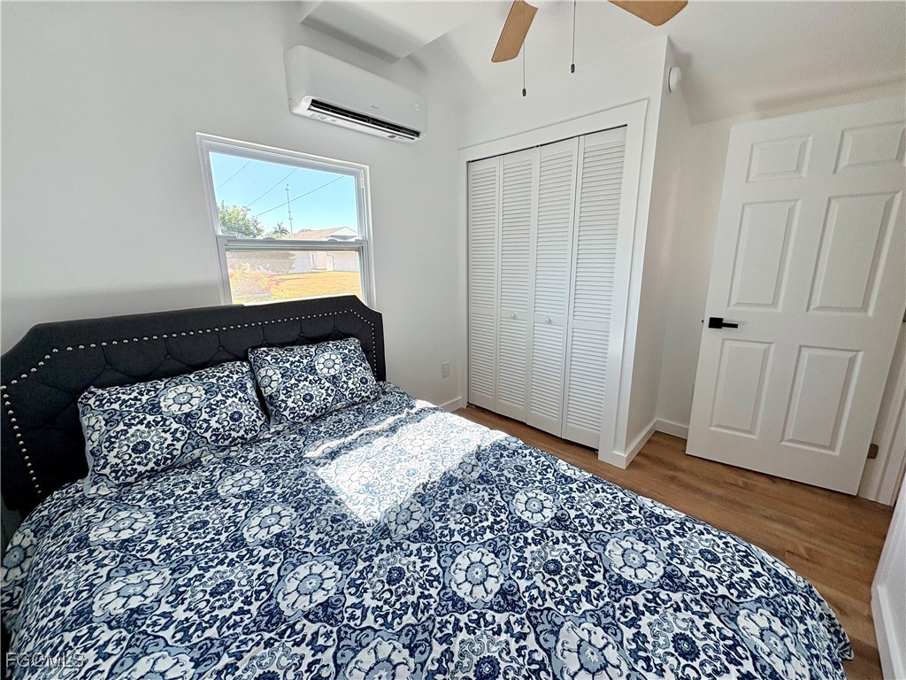 5675 Pine Island Road St. James City, FL 33956 - Photo 21 of 28 a bedroom with a bed and a window