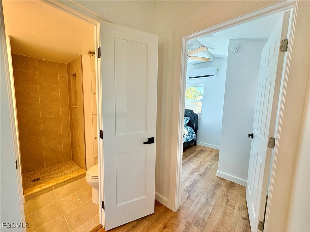5675 Pine Island Road St. James City, FL 33956 - Photo 22 of 28 a view of a bathroom with a tub and shower