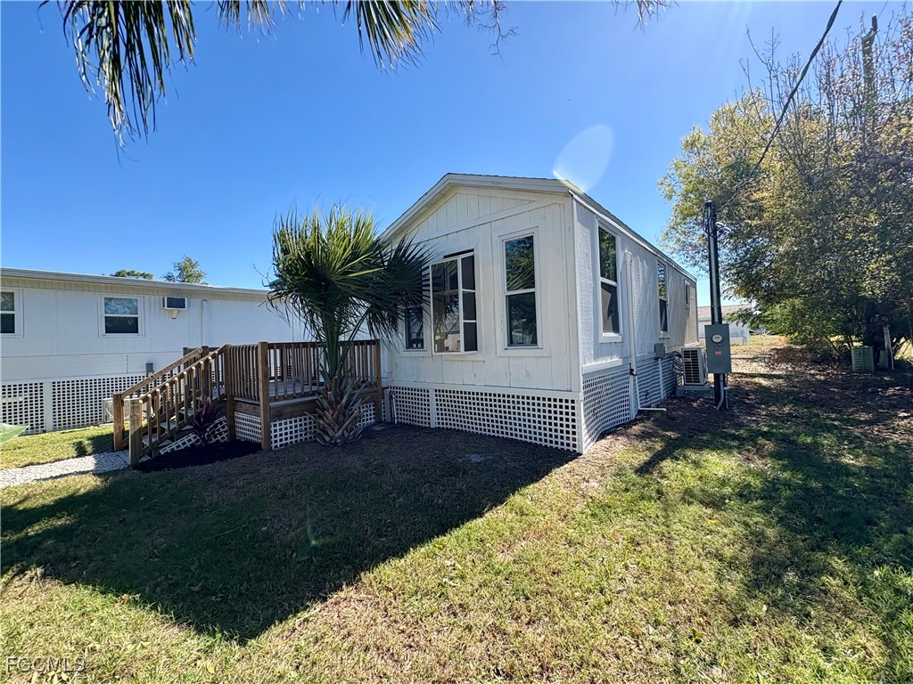 5675 Pine Island Road St. James City, FL 33956 - Photo 5 of 28 a view of a house with a yard