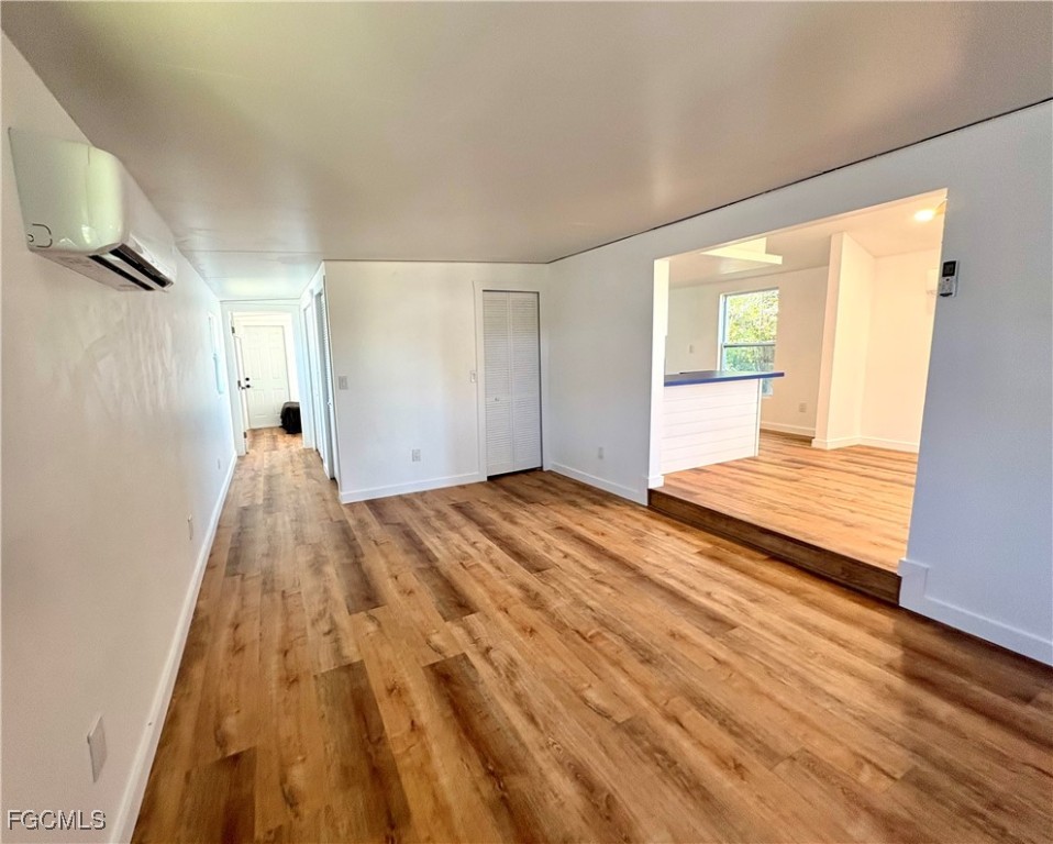5675 Pine Island Road St. James City, FL 33956 - Photo 8 of 28 a view of a room with wooden floor and a window