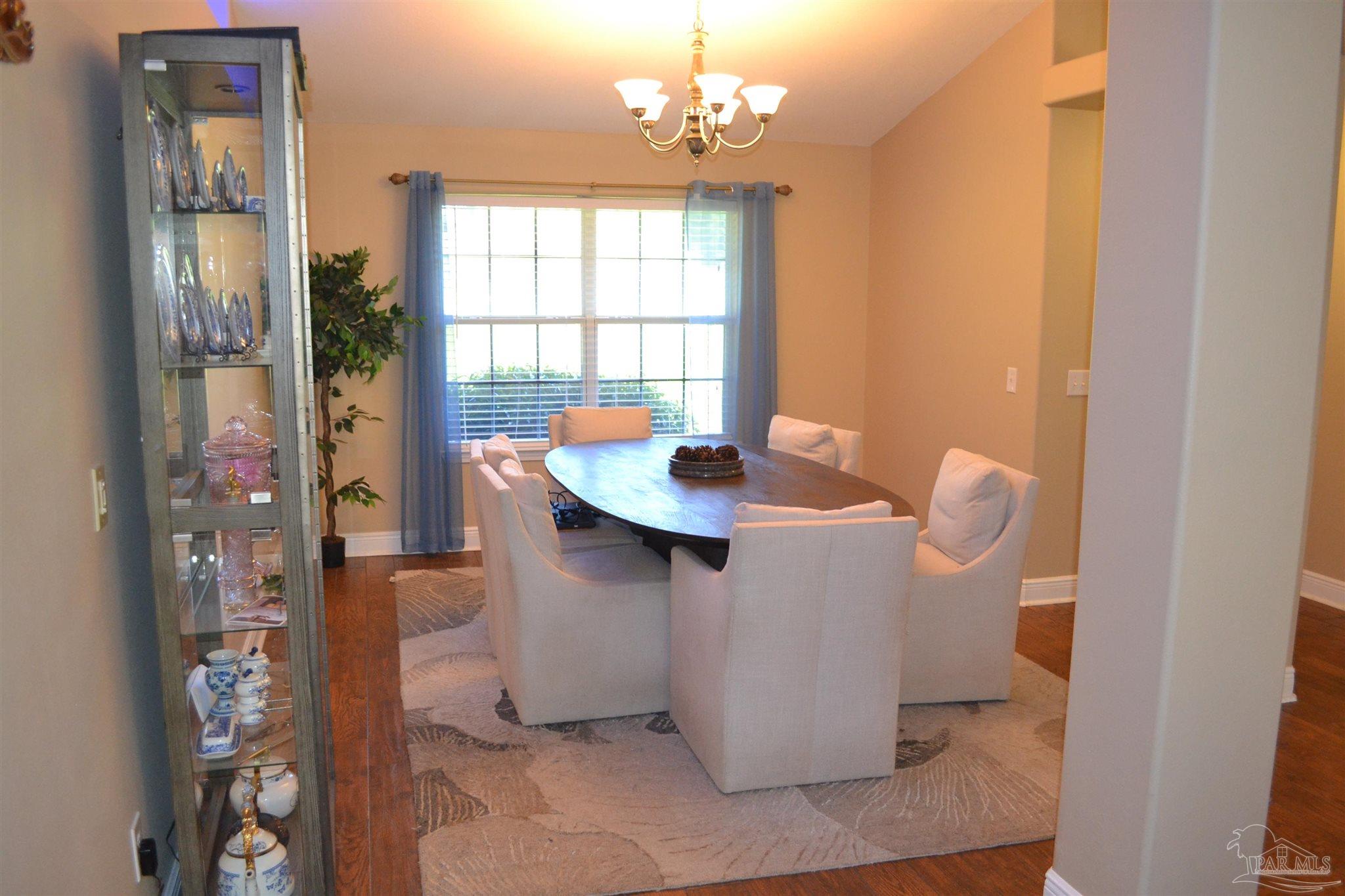 3055 Wallace Lake Road Pace, FL 32571 - Photo 24 of 33 a dining room with furniture and window