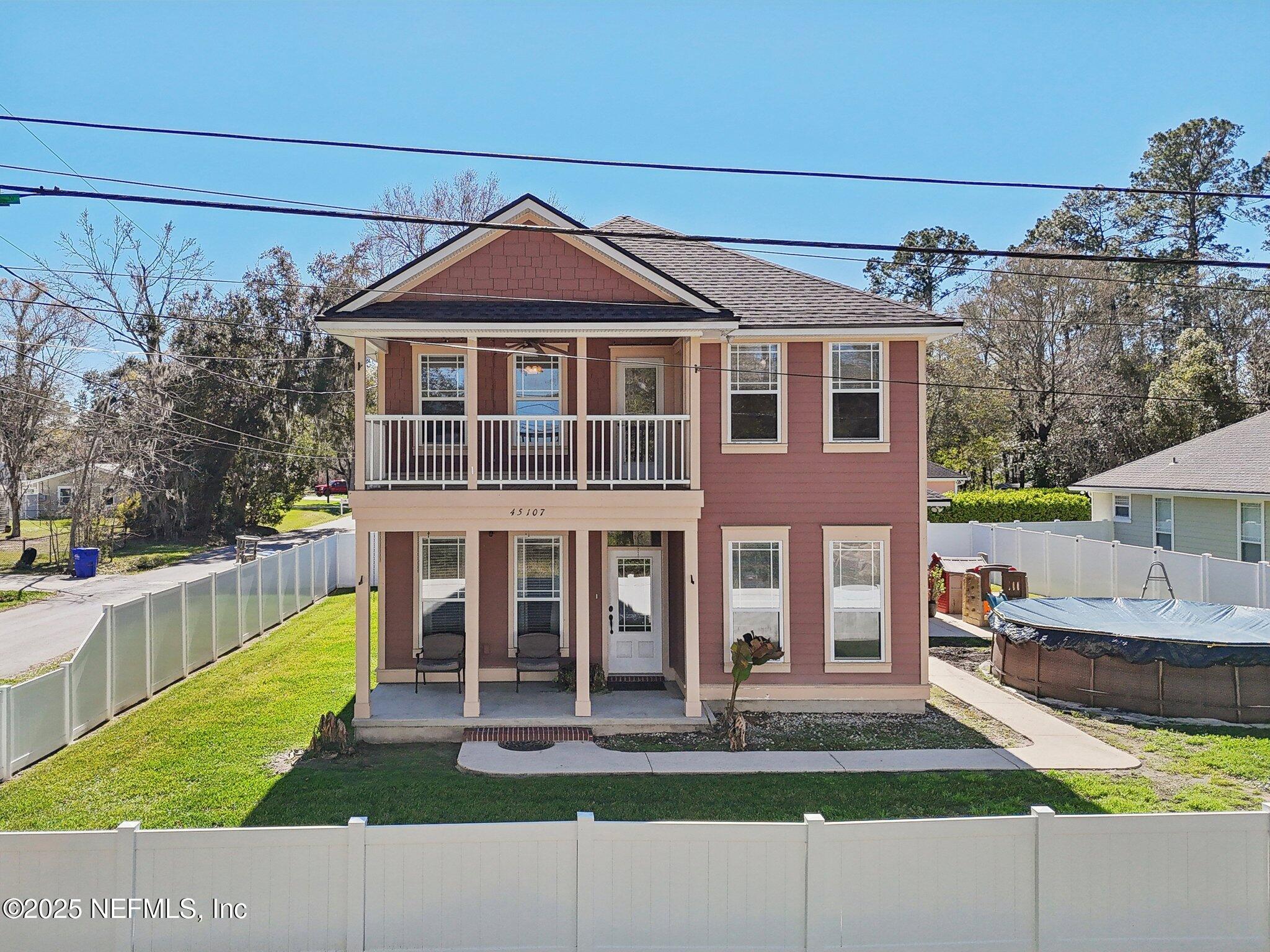 45107 Booth Street Callahan, FL 32011 - Photo 1 of 49 a front view of a house with a yard