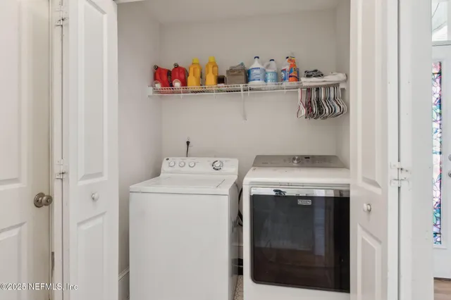 a utility room with dryer and washer