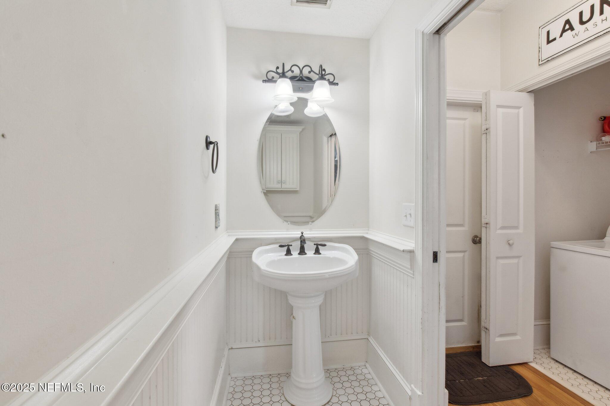 45107 Booth Street Callahan, FL 32011 - Photo 16 of 49 a bathroom with a sink and a mirror