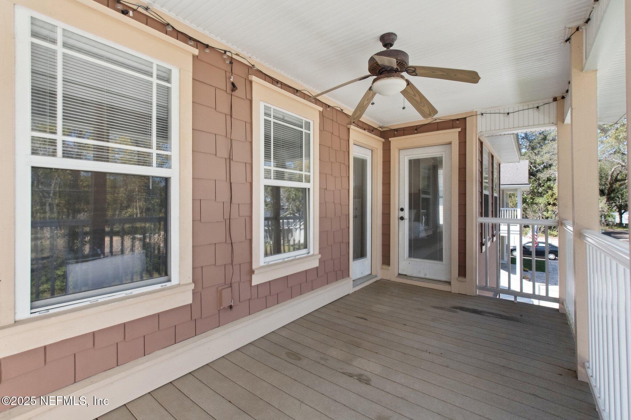 45107 Booth Street Callahan, FL 32011 - Photo 19 of 49 a view of a room with wooden floor and windows