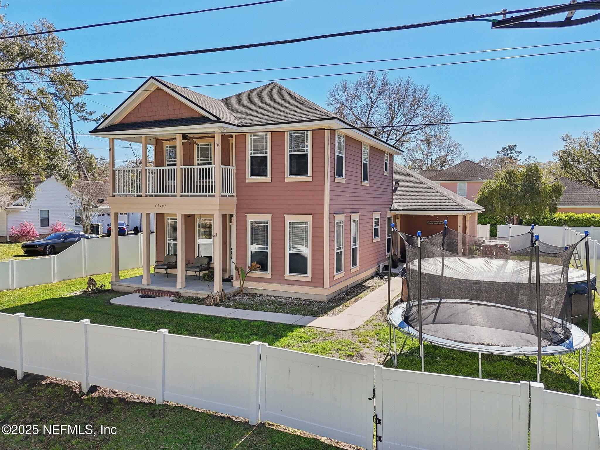 45107 Booth Street Callahan, FL 32011 - Photo 20 of 49 a front view of a house with garden