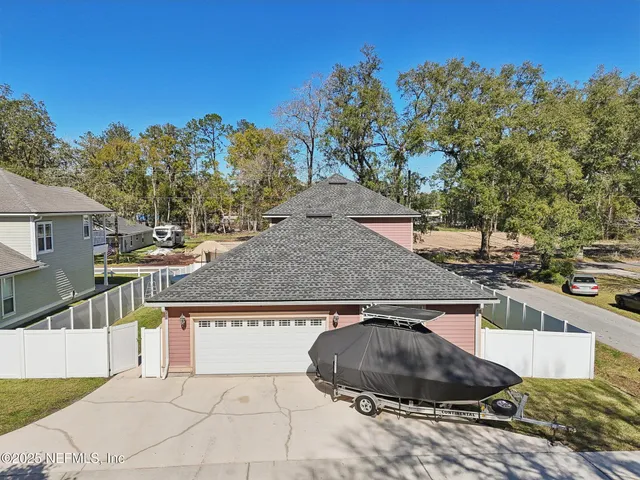 an aerial view of a house with a swimming pool