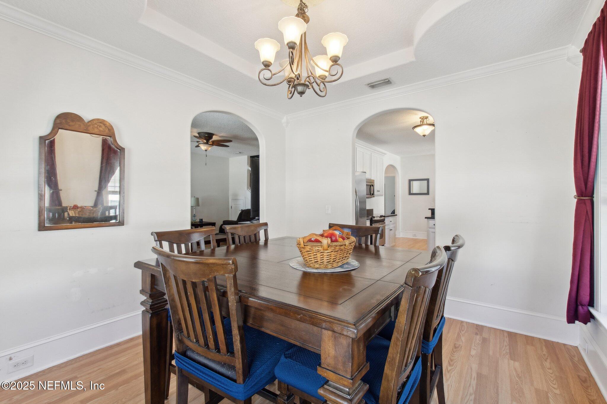 45107 Booth Street Callahan, FL 32011 - Photo 26 of 49 a view of a dining room with furniture and chandelier