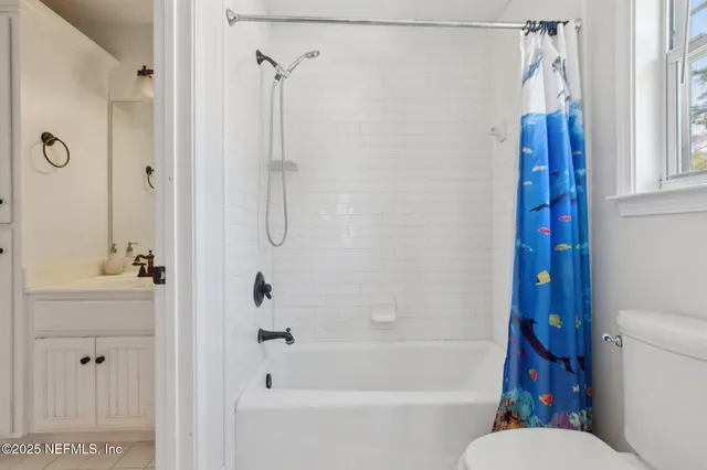 a bedroom with furniture and a chandelier