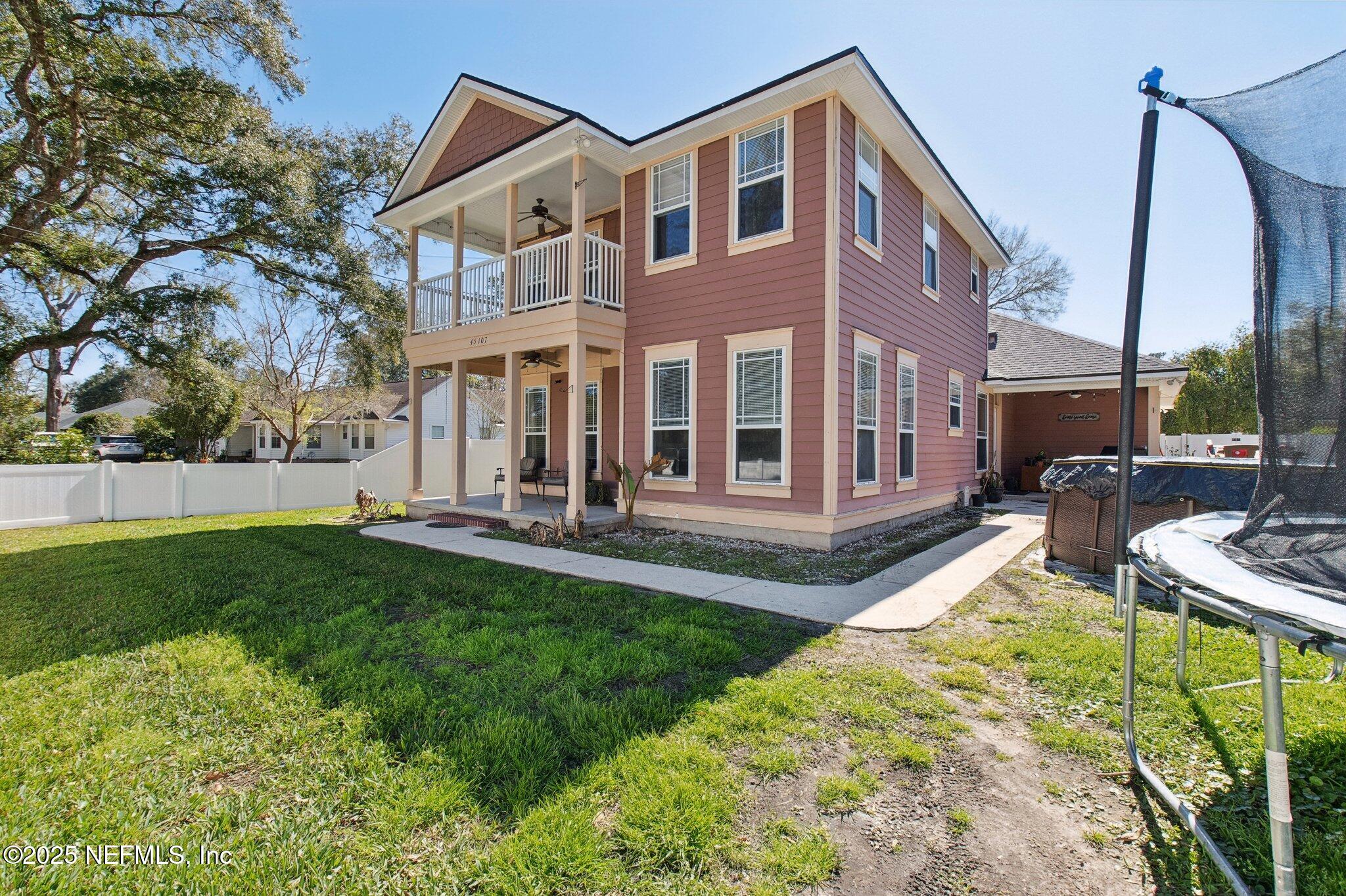 45107 Booth Street Callahan, FL 32011 - Photo 41 of 49 a view of a house with backyard and sitting area