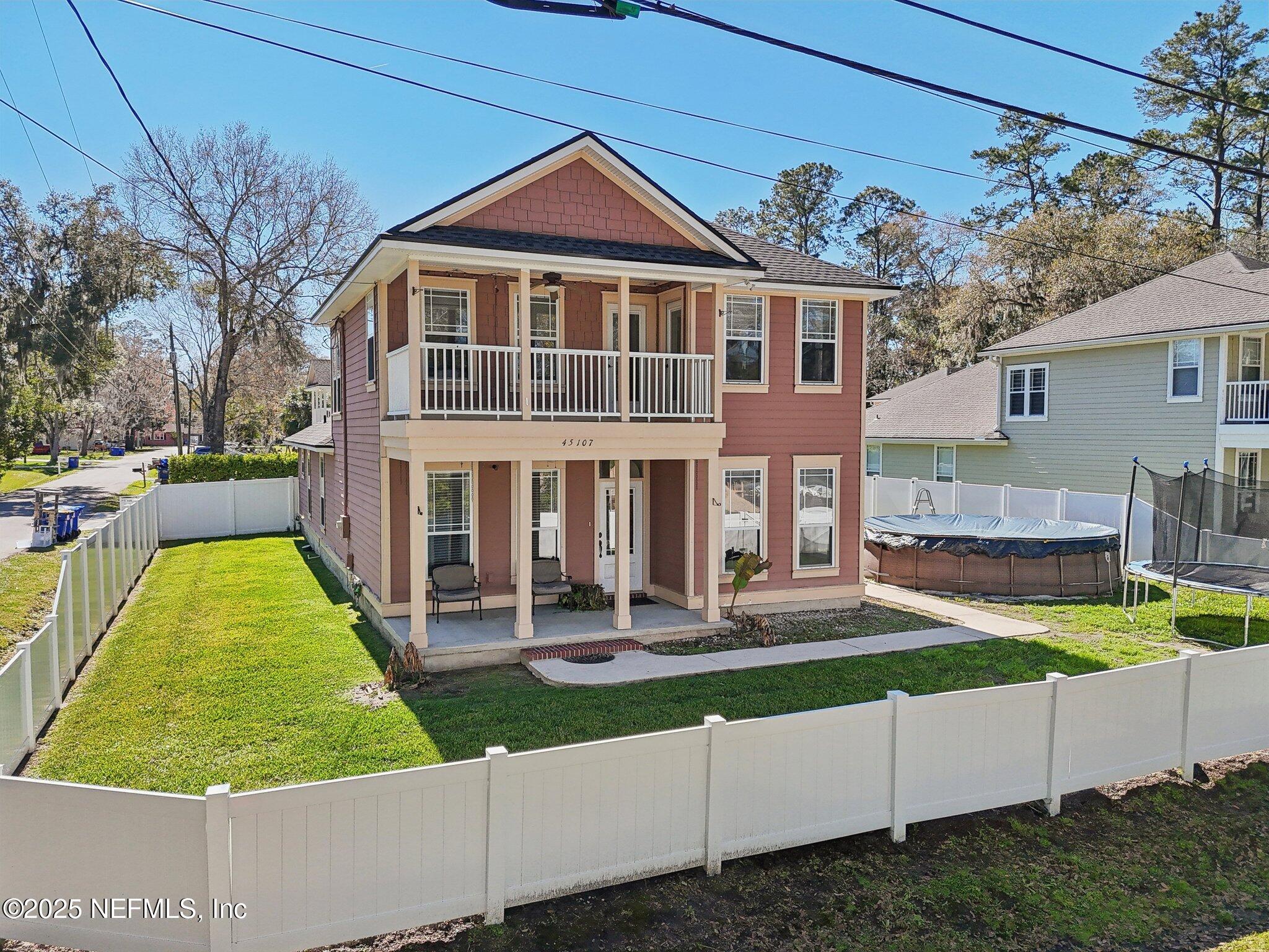 45107 Booth Street Callahan, FL 32011 - Photo 44 of 49 front view of a house with a yard