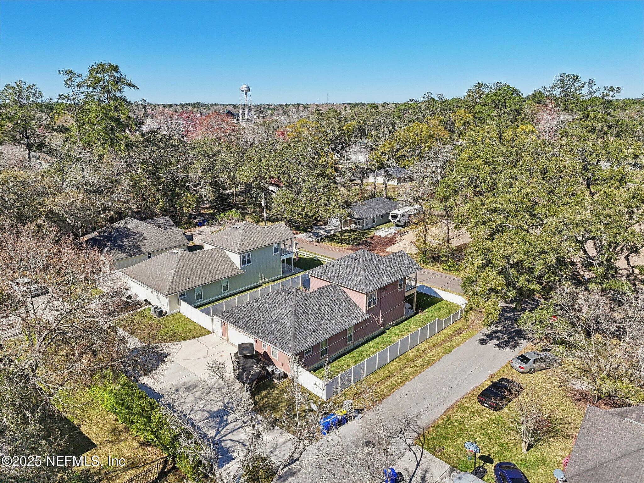 45107 Booth Street Callahan, FL 32011 - Photo 47 of 49 a view of a house with a yard and mountain in the background