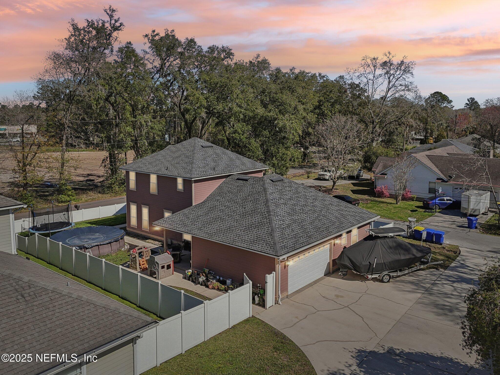 45107 Booth Street Callahan, FL 32011 - Photo 48 of 49 a view of a house with backyard and sitting area