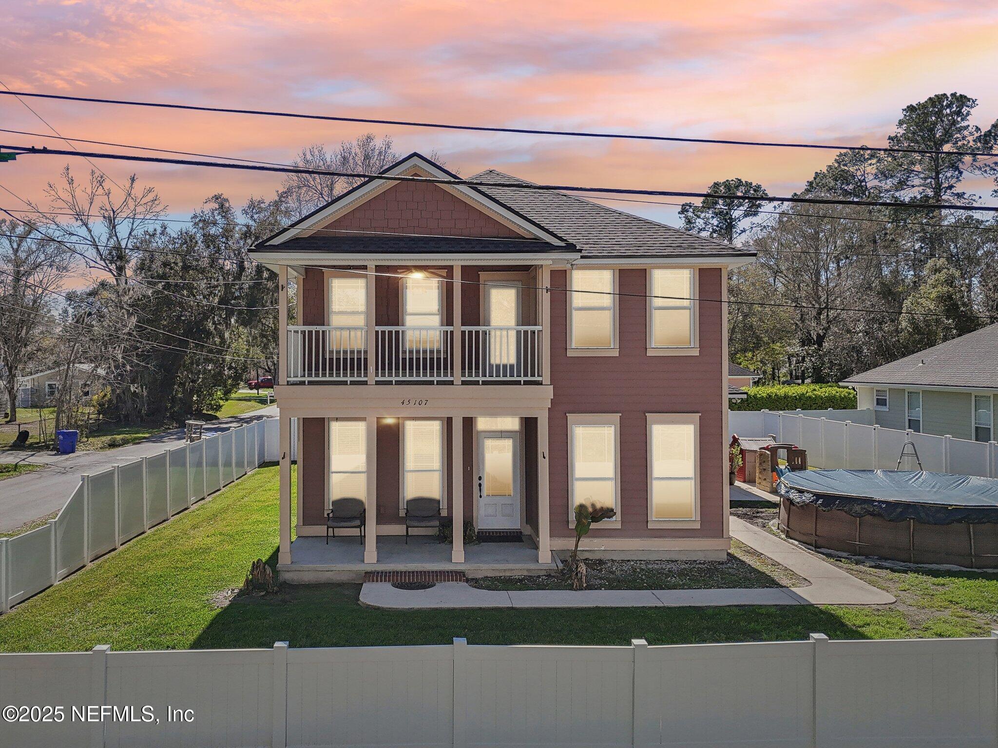 45107 Booth Street Callahan, FL 32011 - Photo 49 of 49 a front view of a house with a yard