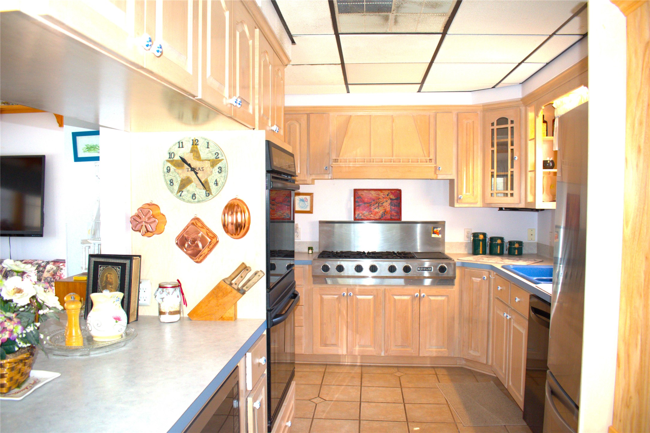 1657 County Road Sargent, TX 77414 - Photo 33 of 46 a kitchen with stainless steel appliances a stove a sink and a microwave