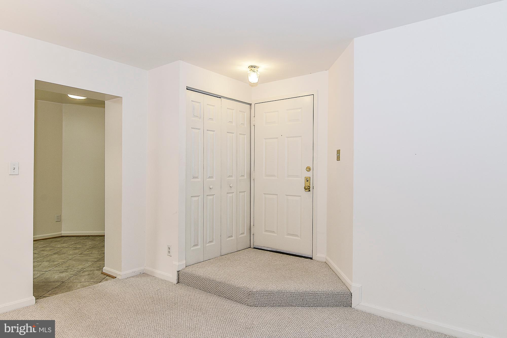 5938 Cove Landing Road, Unit 102A Burke, VA 22015 - Photo 2 of 19 Inviting entryway w/ conveniently located closet!