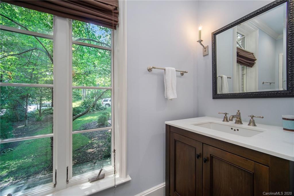 1500 Andover Road Charlotte, NC 28211 - Photo 12 of 24 a bathroom with a sink mirror and a window