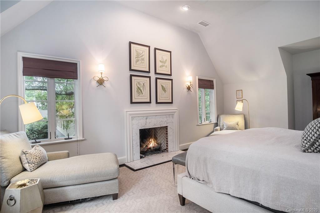 1500 Andover Road Charlotte, NC 28211 - Photo 16 of 24 a bedroom with a bed couches and a fireplace