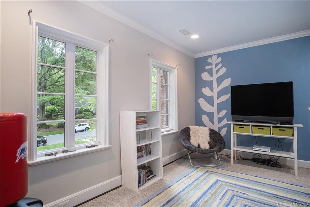 1500 Andover Road Charlotte, NC 28211 - Photo 21 of 24 a living room with furniture and a flat screen tv