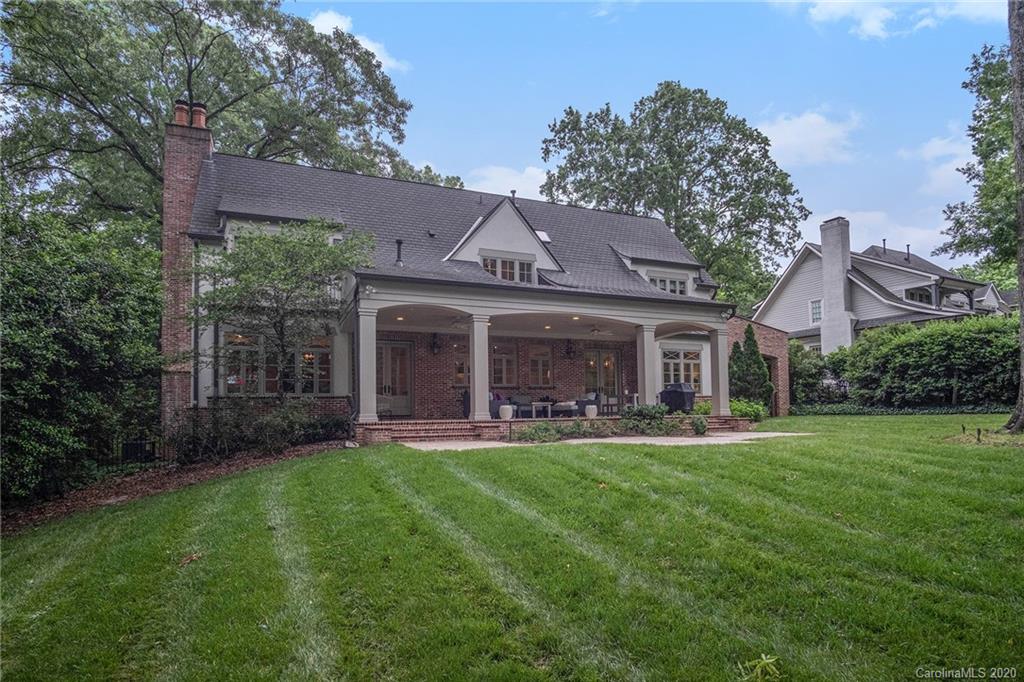 1500 Andover Road Charlotte, NC 28211 - Photo 23 of 24 a front view of a house with a garden and trees