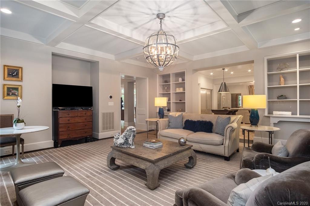 1500 Andover Road Charlotte, NC 28211 - Photo 10 of 24 a living room with furniture a flat screen tv and a chandelier
