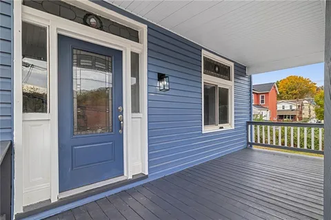 a view of a brick house with a large window