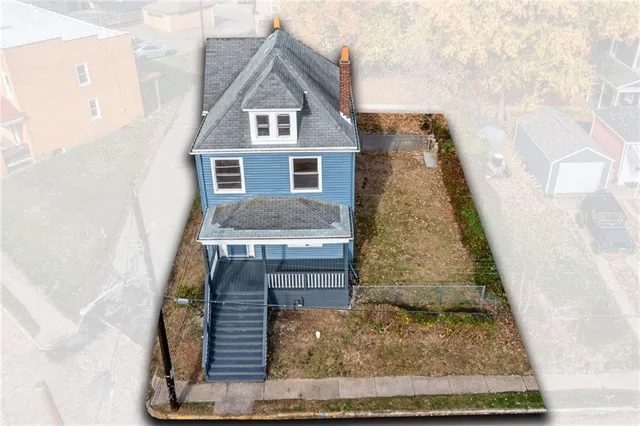 a front view of a house with large windows