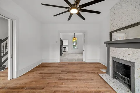 a bedroom with a bed and a fireplace