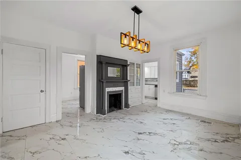 a view of a hallway with a fireplace