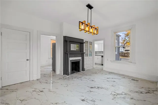 a view of a hallway with a fireplace