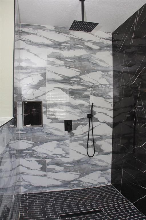 1991 Sanderlin Point Loop Apopka, FL 32703 - Photo 12 of 27 a bathroom with a shower