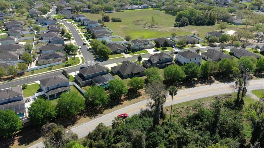 1991 Sanderlin Point Loop Apopka, FL 32703 - Photo 16 of 27 an aerial view of residential houses with outdoor space and lake view