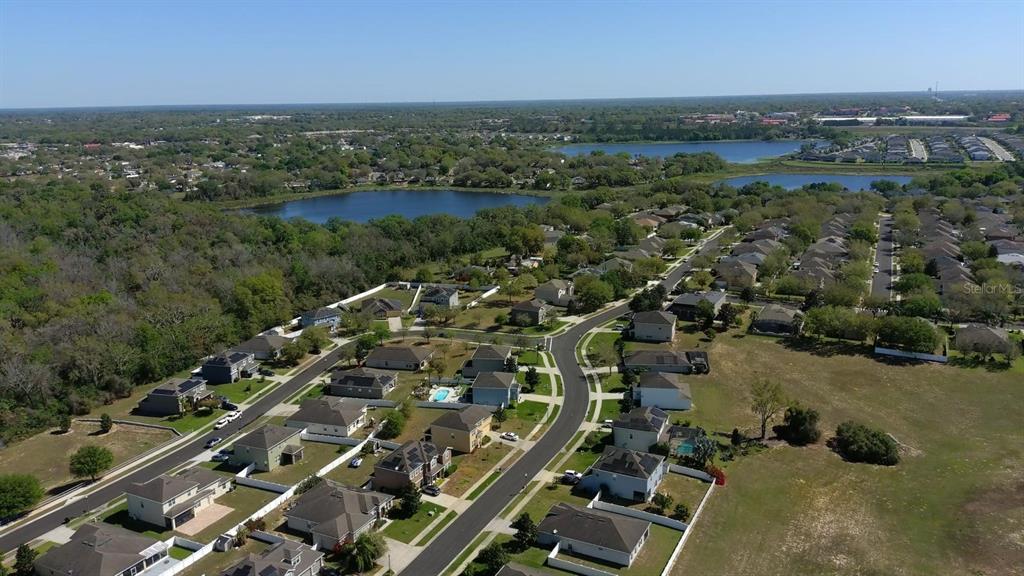 1991 Sanderlin Point Loop Apopka, FL 32703 - Photo 20 of 27 an aerial view of a city with lots of residential buildings