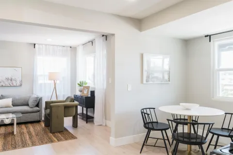 a view of a livingroom with furniture and a window
