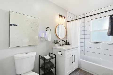 a bathroom with a toilet a sink and a bathtub
