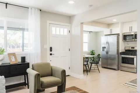 a living room with furniture and a window