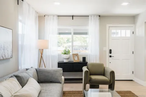 a living room with furniture and a window