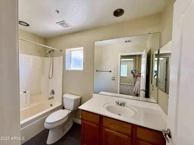 a bathroom with a sink toilet tub and shower