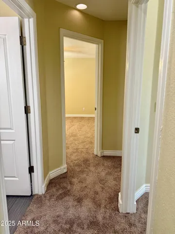 a large kitchen with a large counter top appliances and cabinets