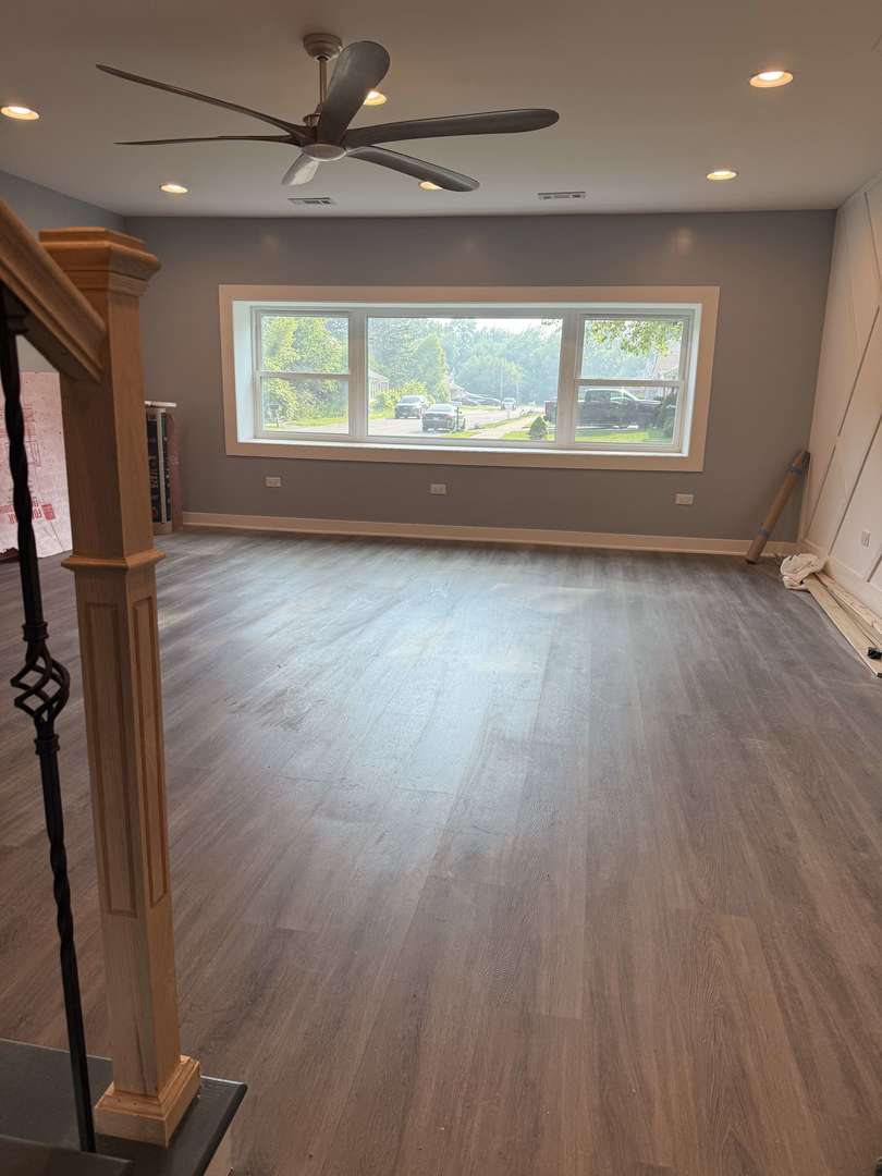 13621 Homan Avenue Robbins, IL 60472 - Photo 19 of 25 wooden floor in an empty room with a window