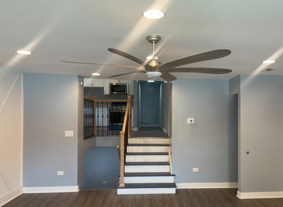 13621 Homan Avenue Robbins, IL 60472 - Photo 20 of 25 a view of a hallway with wooden floor and staircase