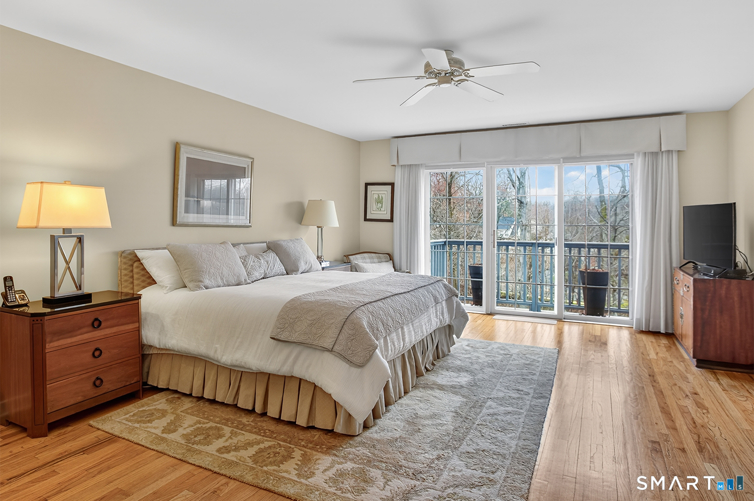 23 Balmaha Cl Fairfield, CT 06825 - Photo 14 of 29 a spacious bedroom with a large bed and a tv on table