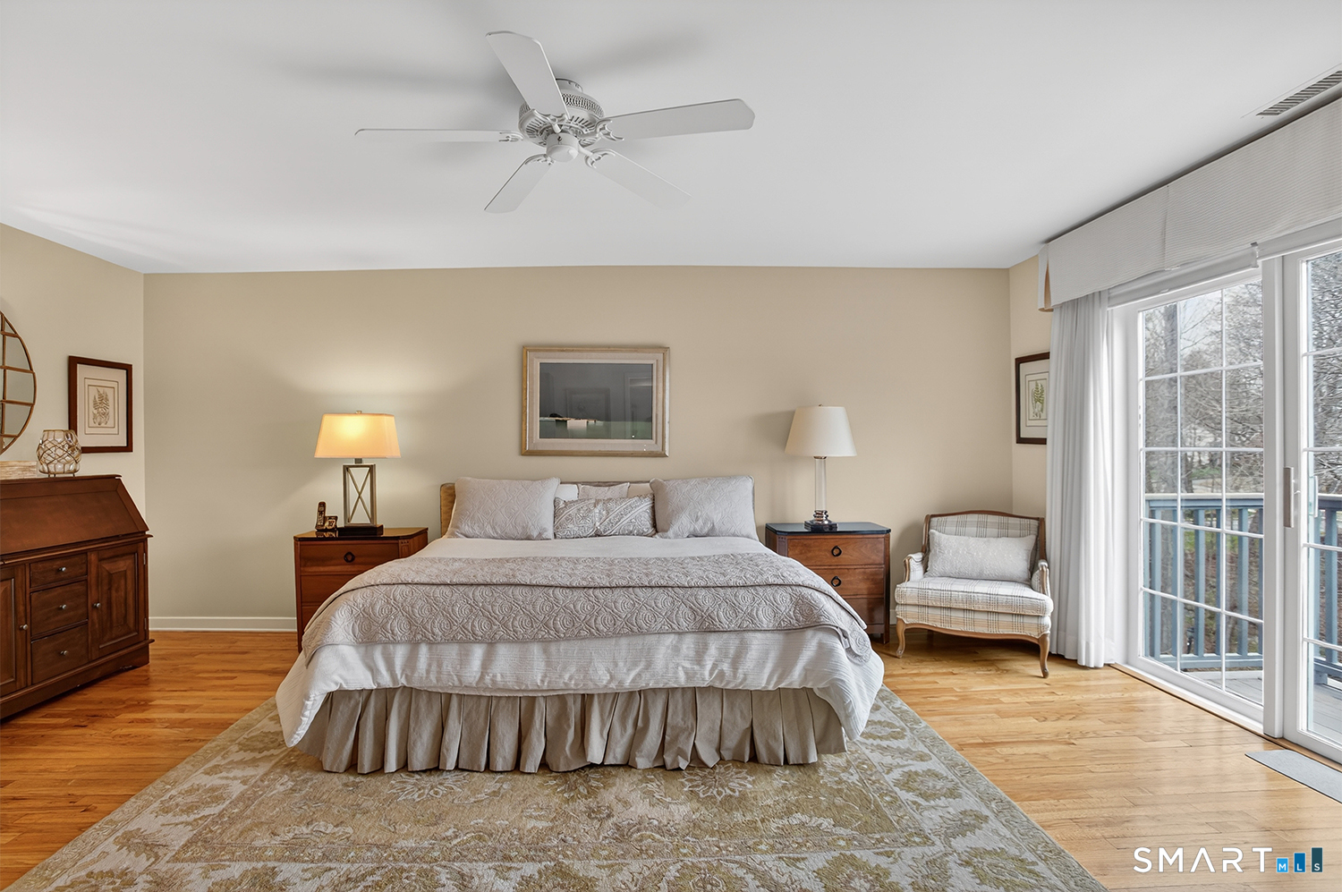 23 Balmaha Cl Fairfield, CT 06825 - Photo 16 of 29 a bedroom with a bed wooden floor and lamp