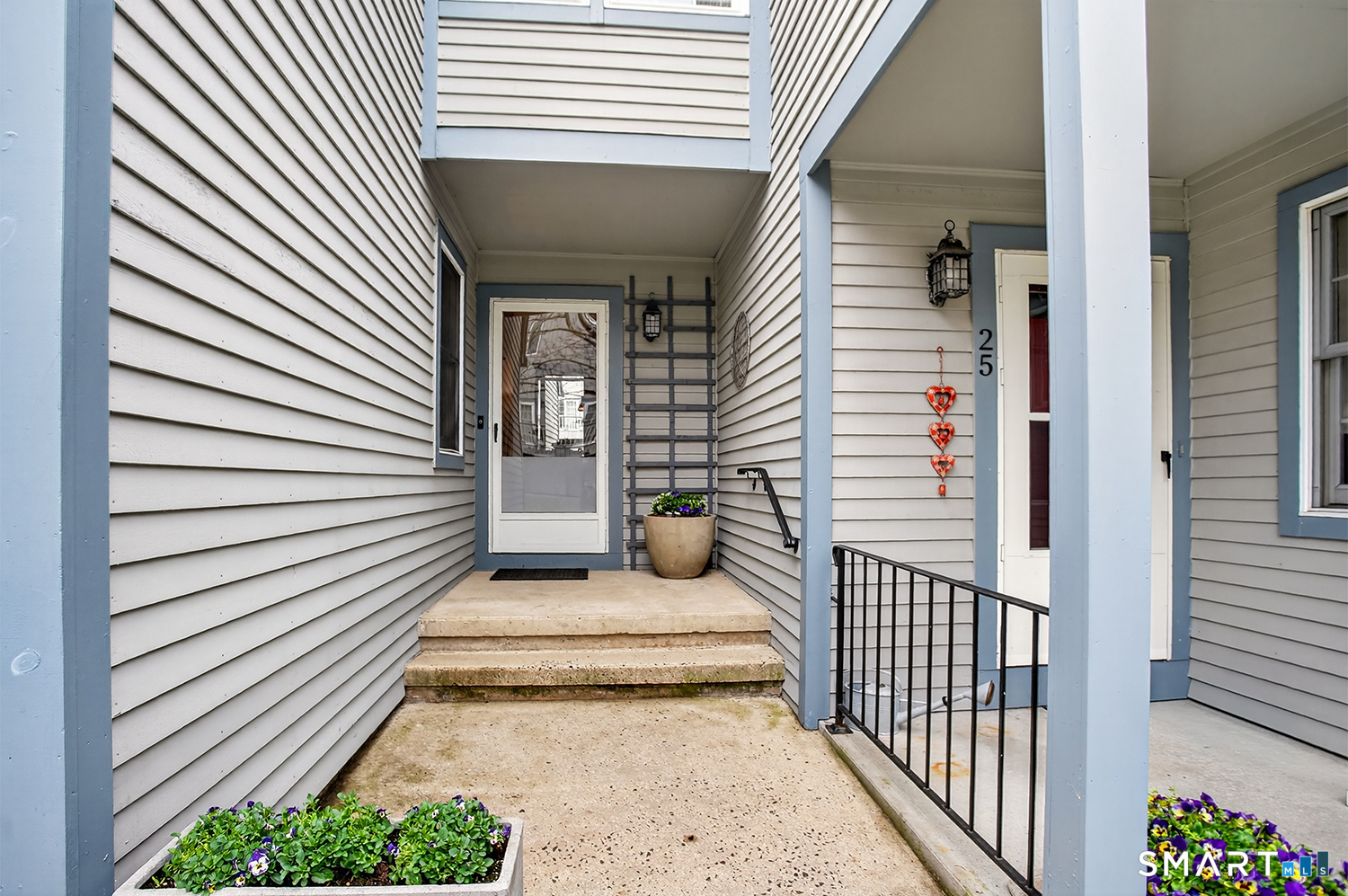 23 Balmaha Cl Fairfield, CT 06825 - Photo 2 of 29 a view of a porch with a bench