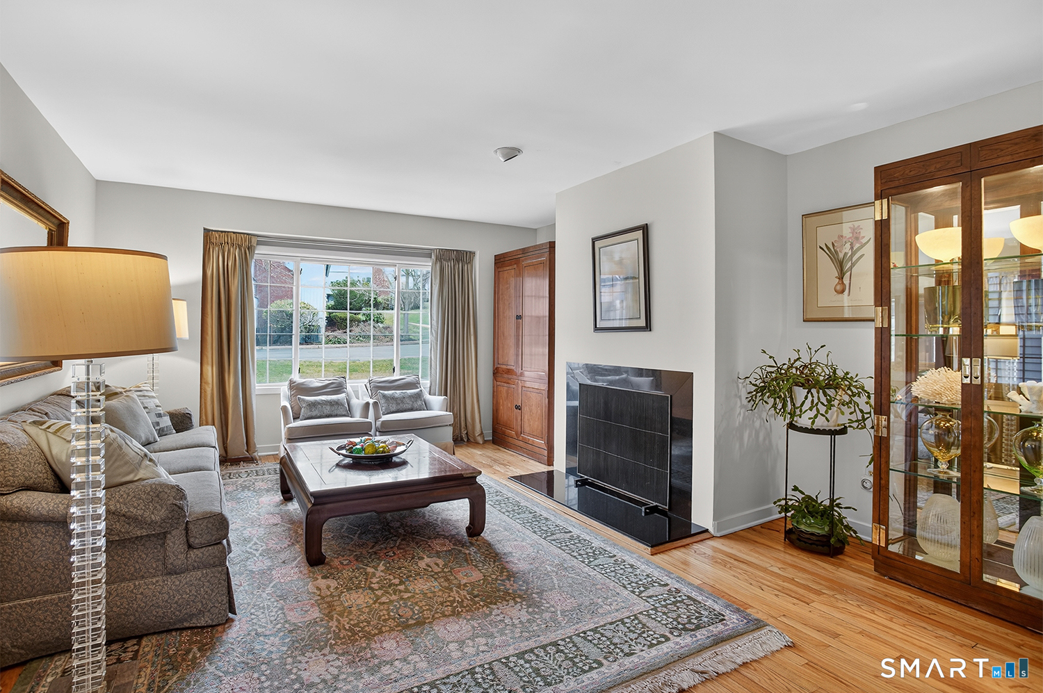 23 Balmaha Cl Fairfield, CT 06825 - Photo 5 of 29 a living room with furniture and a fireplace