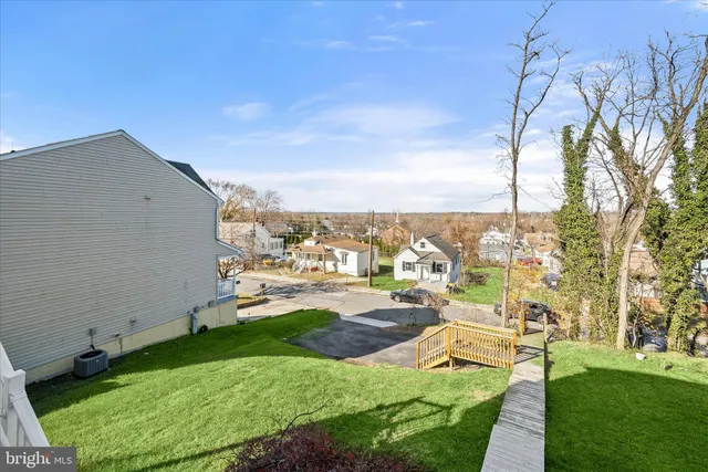 a view of a backyard with sitting area