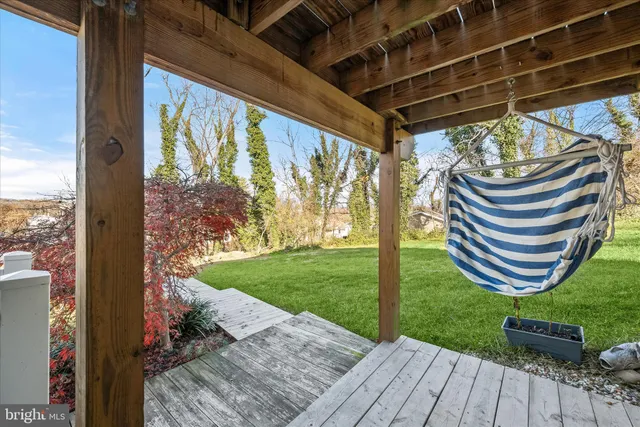 a view of a yard with swimming pool